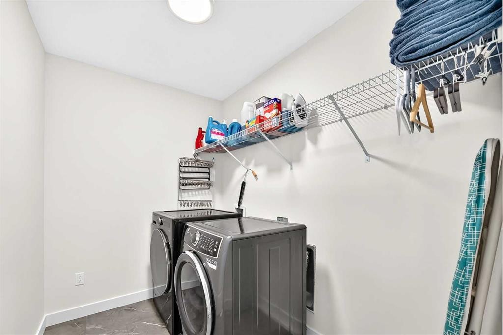 27 Belvedere Point Se, Calgary, AB - Indoor Photo Showing Laundry Room