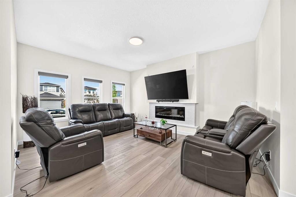 27 Belvedere Point Se, Calgary, AB - Indoor Photo Showing Living Room With Fireplace