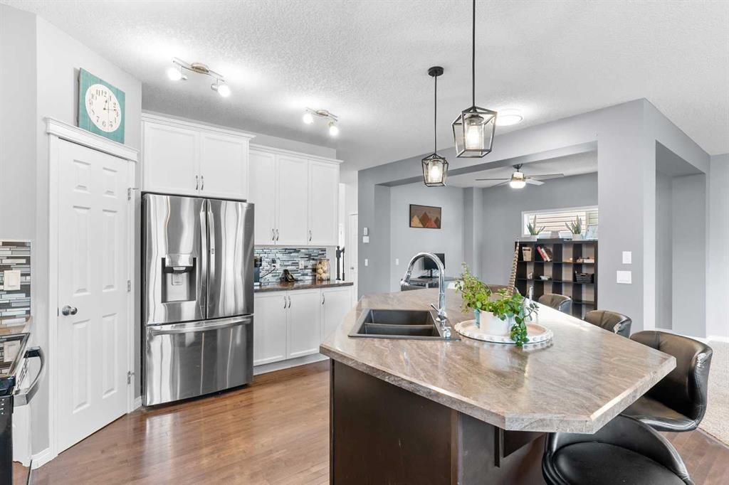 106 Morningside Circle Sw, Airdrie, AB - Indoor Photo Showing Kitchen With Double Sink
