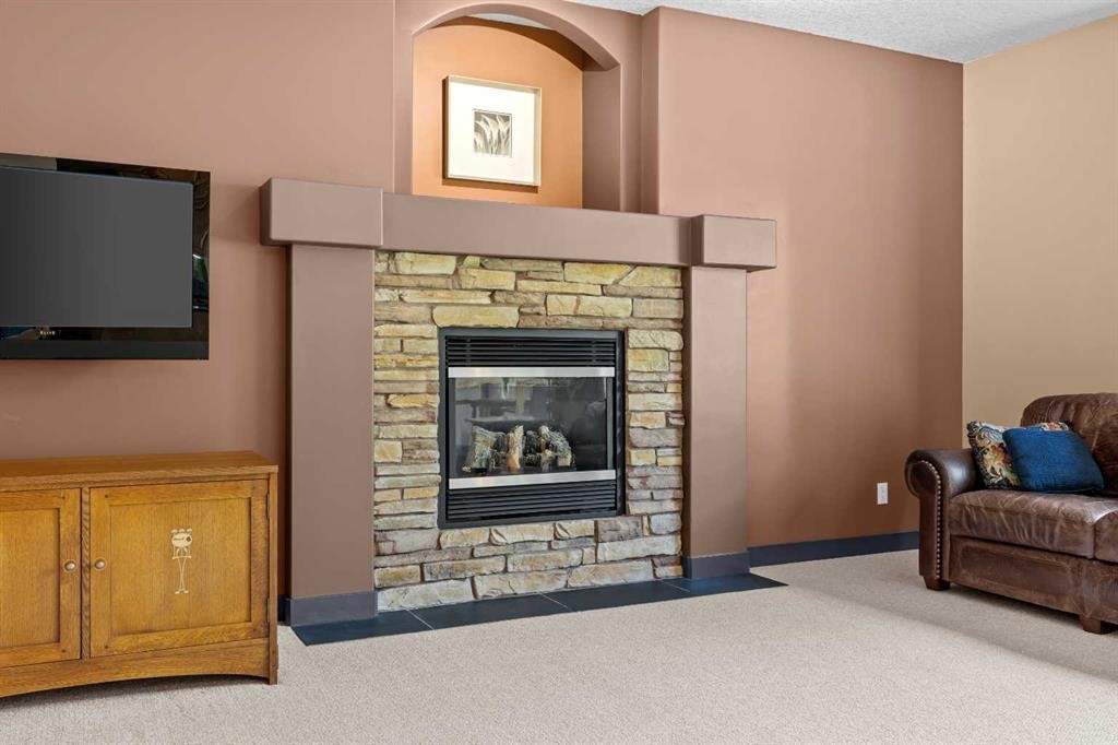 139 Tuscany Ridge Close Nw, Calgary, AB - Indoor Photo Showing Living Room With Fireplace