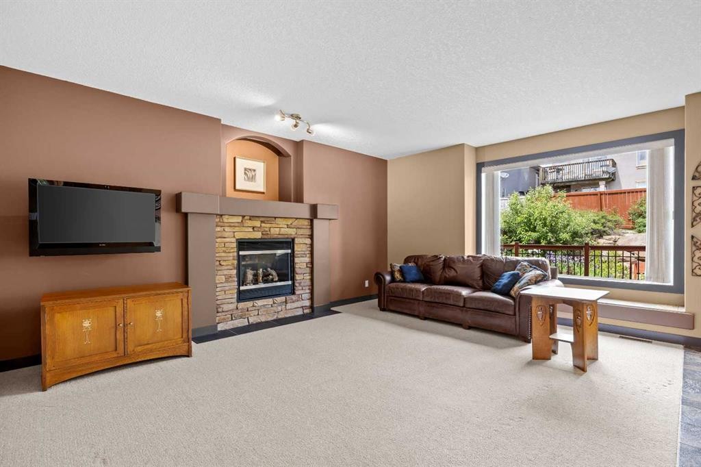 139 Tuscany Ridge Close Nw, Calgary, AB - Indoor Photo Showing Living Room With Fireplace