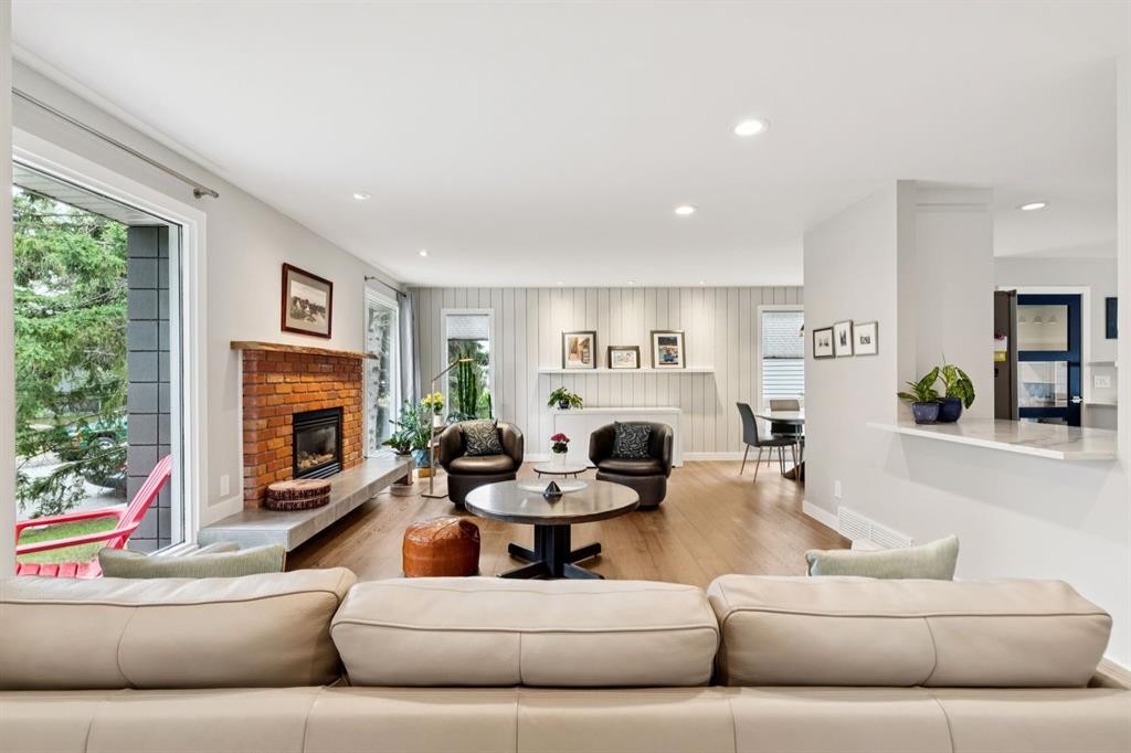 5689 Brenner Crescent Nw, Calgary, AB - Indoor Photo Showing Living Room With Fireplace