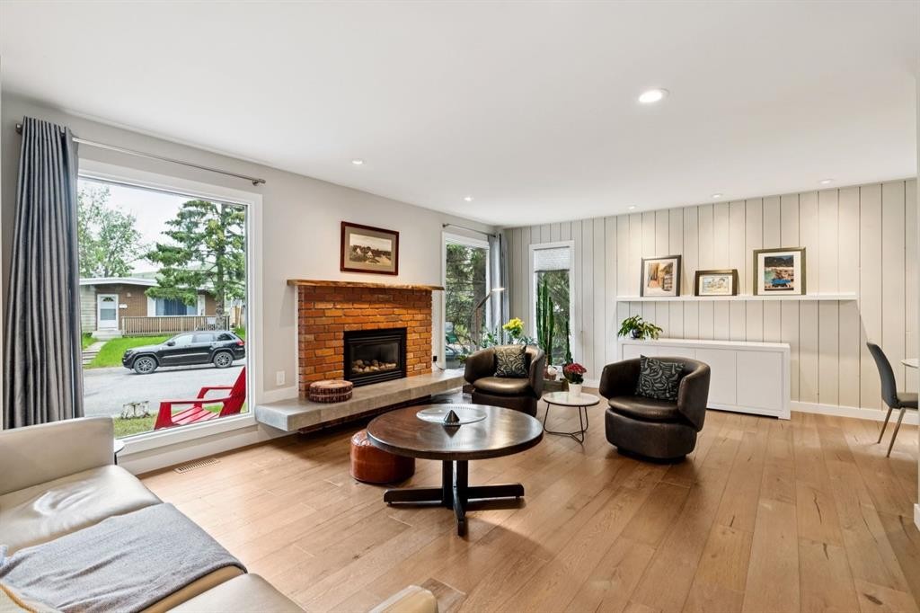 5689 Brenner Crescent Nw, Calgary, AB - Indoor Photo Showing Living Room With Fireplace