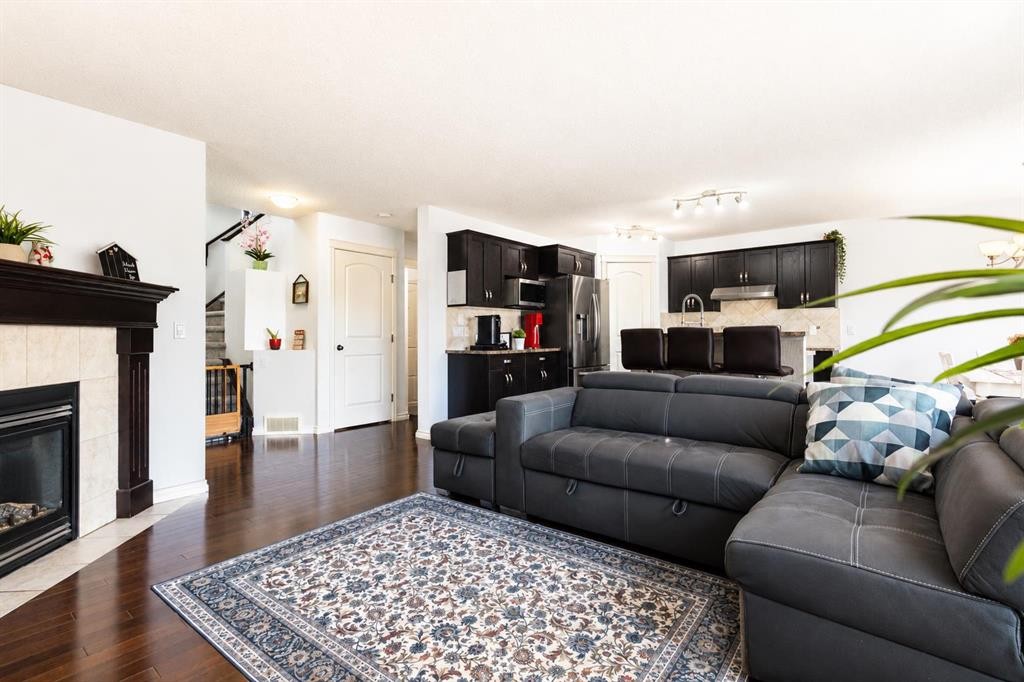 821 Auburn Bay Boulevard Se, Calgary, AB - Indoor Photo Showing Living Room With Fireplace