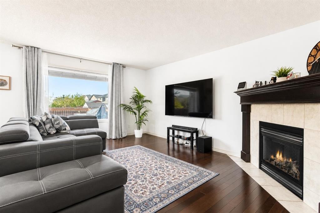 821 Auburn Bay Boulevard Se, Calgary, AB - Indoor Photo Showing Living Room With Fireplace