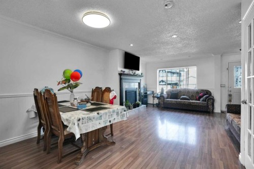 156 Saddlecrest Place Ne, Calgary, AB - Indoor With Fireplace