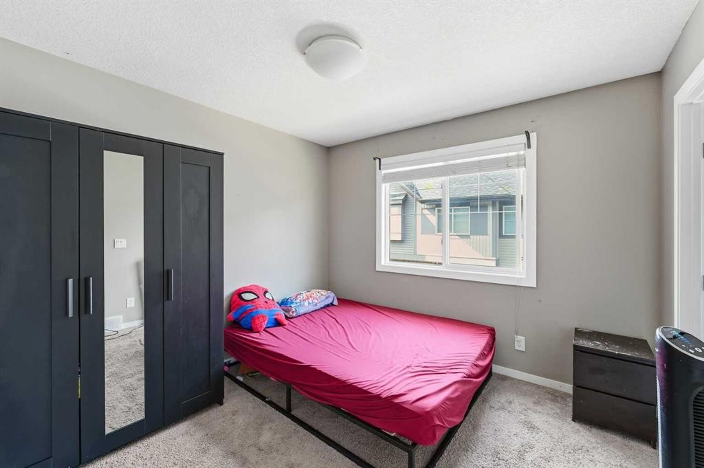 28 New Brighton Point Se, Calgary, AB - Indoor Photo Showing Bedroom