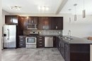 28 New Brighton Point Se, Calgary, AB  - Indoor Photo Showing Kitchen With Stainless Steel Kitchen With Double Sink With Upgraded Kitchen 