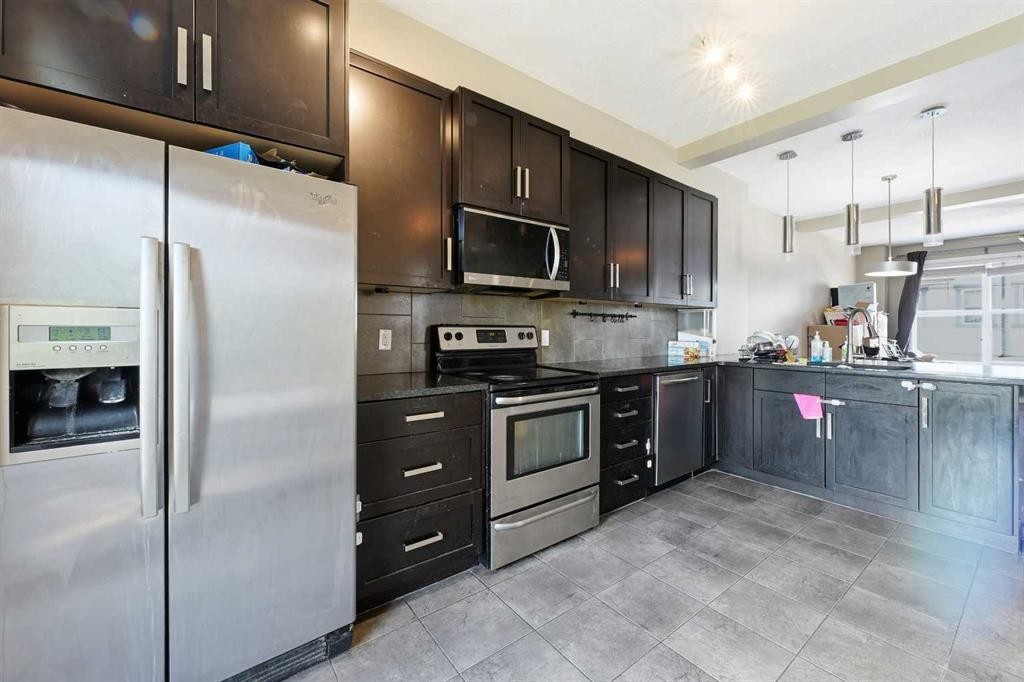 28 New Brighton Point Se, Calgary, AB - Indoor Photo Showing Kitchen With Stainless Steel Kitchen With Upgraded Kitchen