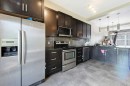 28 New Brighton Point Se, Calgary, AB  - Indoor Photo Showing Kitchen With Stainless Steel Kitchen With Upgraded Kitchen 