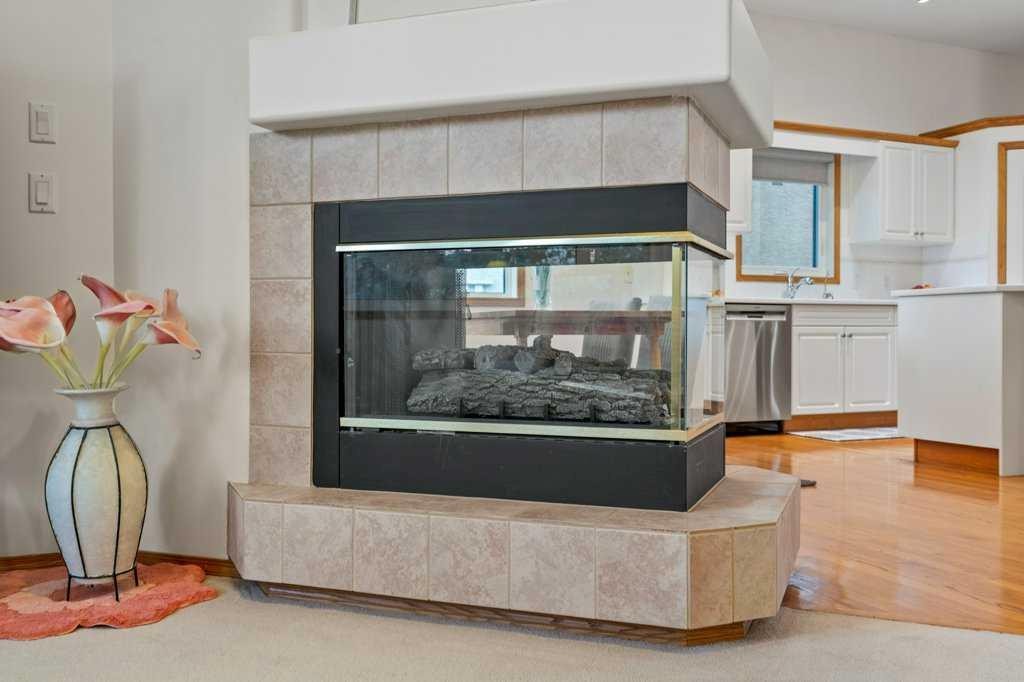 125 Woodpark Close Sw, Calgary, AB - Indoor With Fireplace