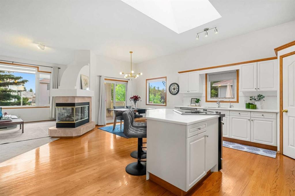 125 Woodpark Close Sw, Calgary, AB - Indoor With Fireplace