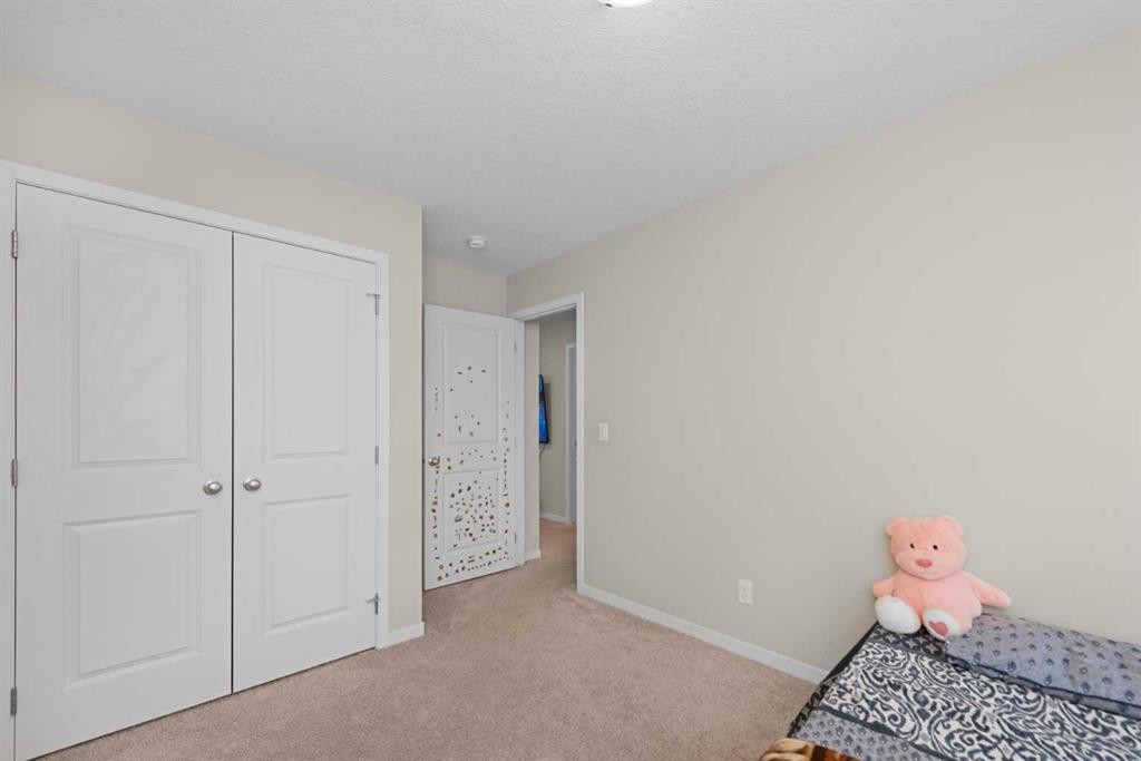 59 Cornerbrook Avenue Ne, Calgary, AB - Indoor Photo Showing Bedroom