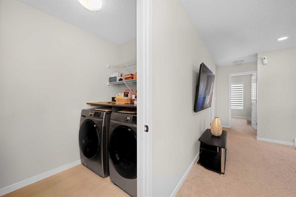 59 Cornerbrook Avenue Ne, Calgary, AB - Indoor Photo Showing Laundry Room