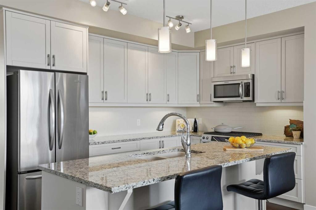 26 Cranbrook Villas Se, Calgary, AB - Indoor Photo Showing Kitchen With Stainless Steel Kitchen With Upgraded Kitchen