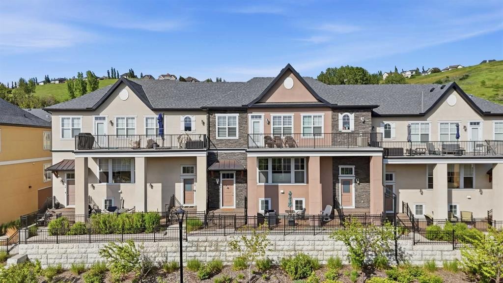 26 Cranbrook Villas Se, Calgary, AB - Outdoor With Deck Patio Veranda With Facade