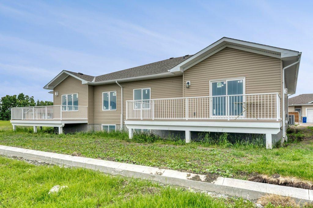 160 Ridgestone Lane, Diamond Valley, AB - Outdoor With Deck Patio Veranda