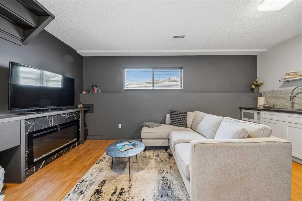 119 Applemont Close Se, Calgary, AB - Indoor Photo Showing Living Room
