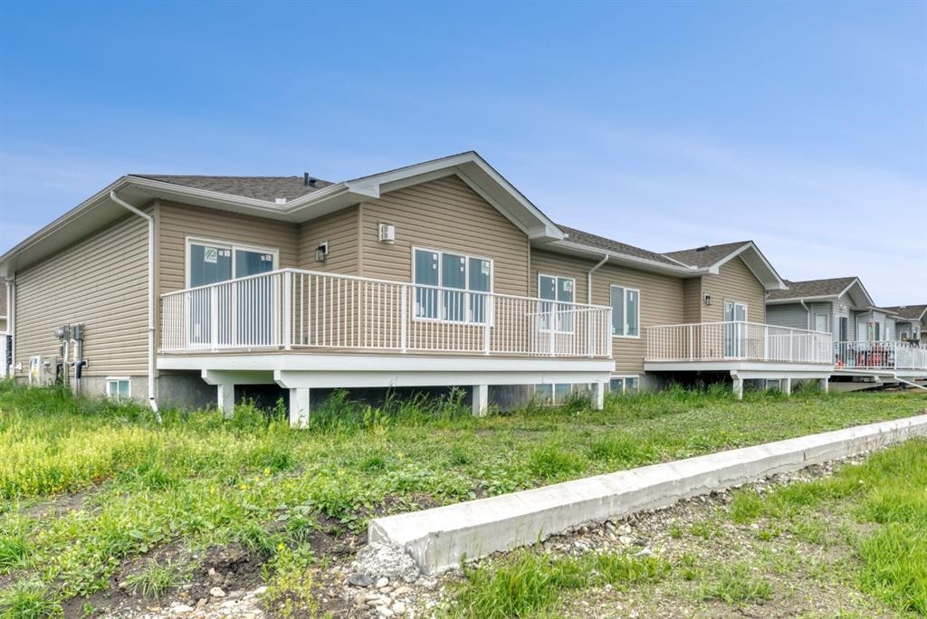 164 Ridgestone Lane, Diamond Valley, AB - Outdoor With Deck Patio Veranda