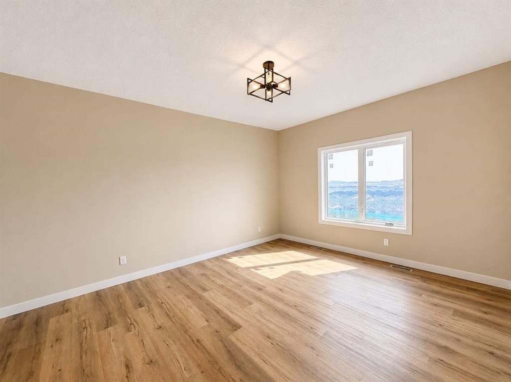 164 Ridgestone Lane, Diamond Valley, AB - Indoor Photo Showing Other Room