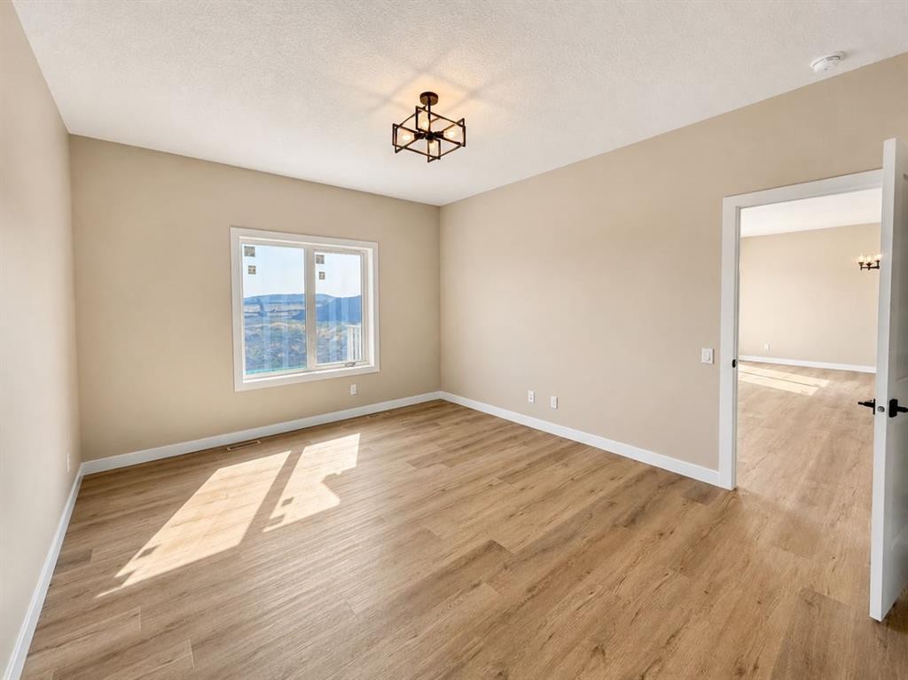 164 Ridgestone Lane, Diamond Valley, AB - Indoor Photo Showing Other Room