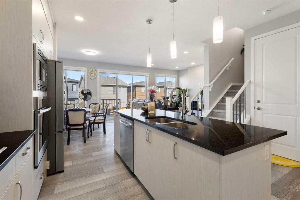 35 Lucas Passage Nw, Calgary, AB - Indoor Photo Showing Kitchen With Double Sink With Upgraded Kitchen
