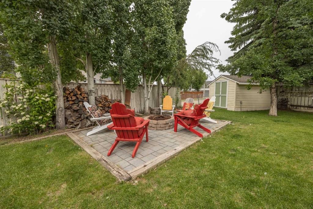 19 Mckenzie Lake Manor Se, Calgary, AB - Outdoor With Backyard