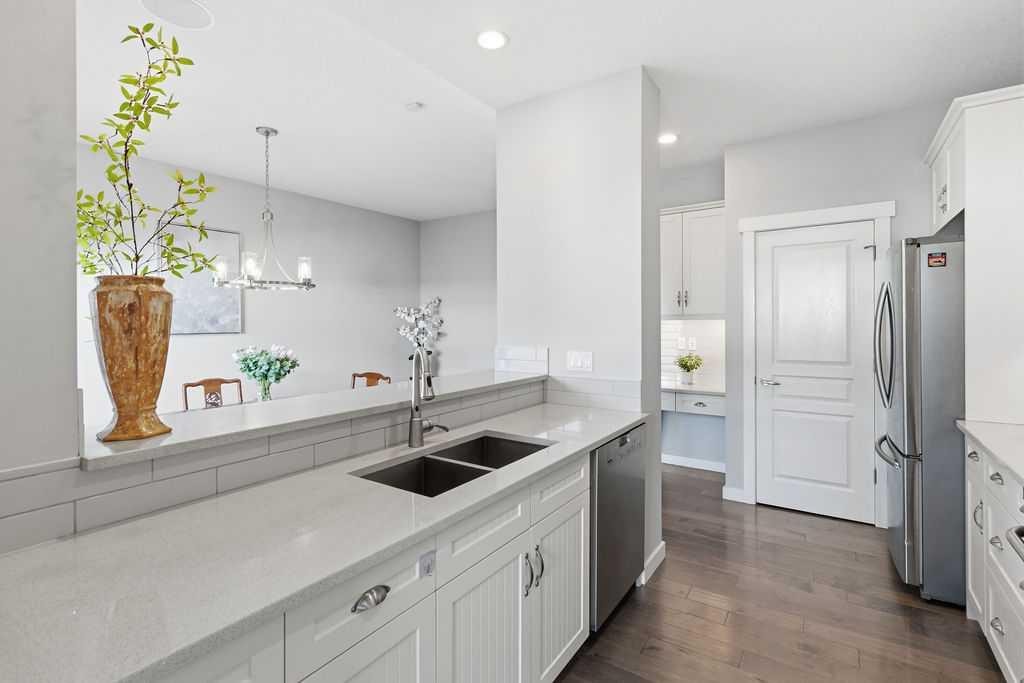 122 Ypres Green Sw, Calgary, AB - Indoor Photo Showing Kitchen With Double Sink