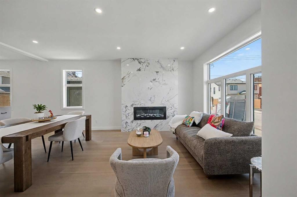 753 Centre Avenue Ne, Calgary, AB - Indoor Photo Showing Living Room With Fireplace