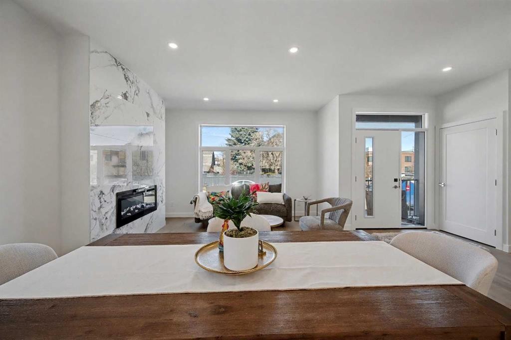 753 Centre Avenue Ne, Calgary, AB - Indoor Photo Showing Dining Room With Fireplace