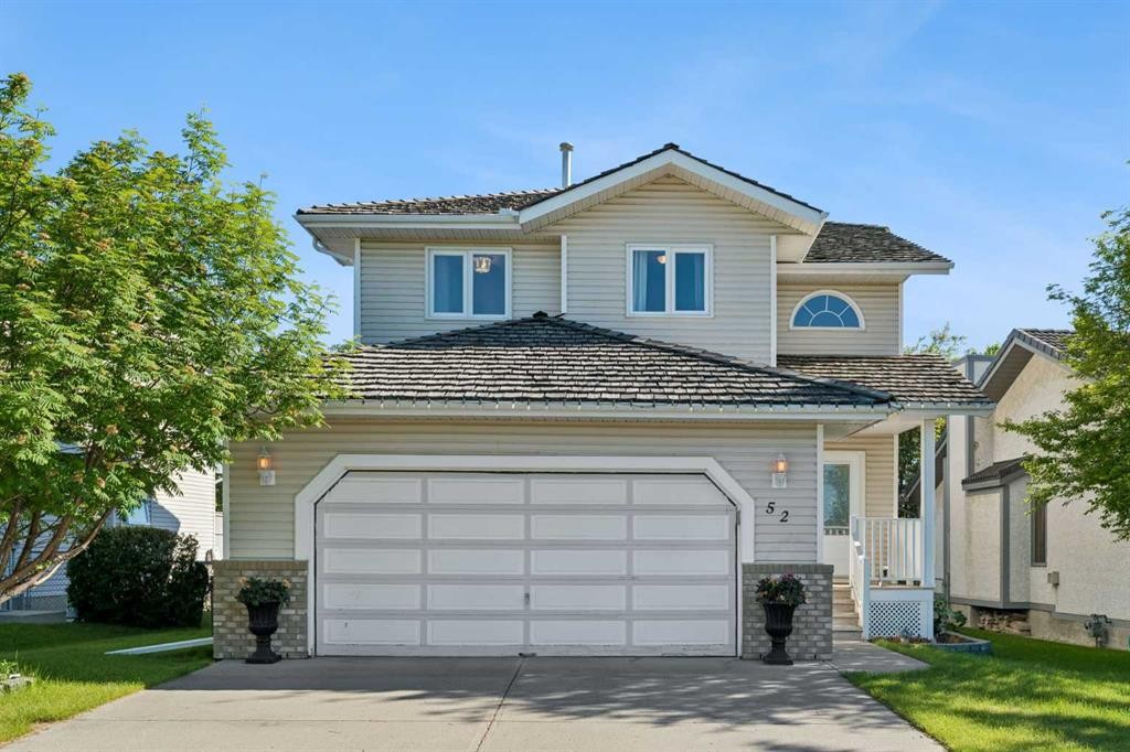 52 West Edge Road, Cochrane, AB - Outdoor With Facade