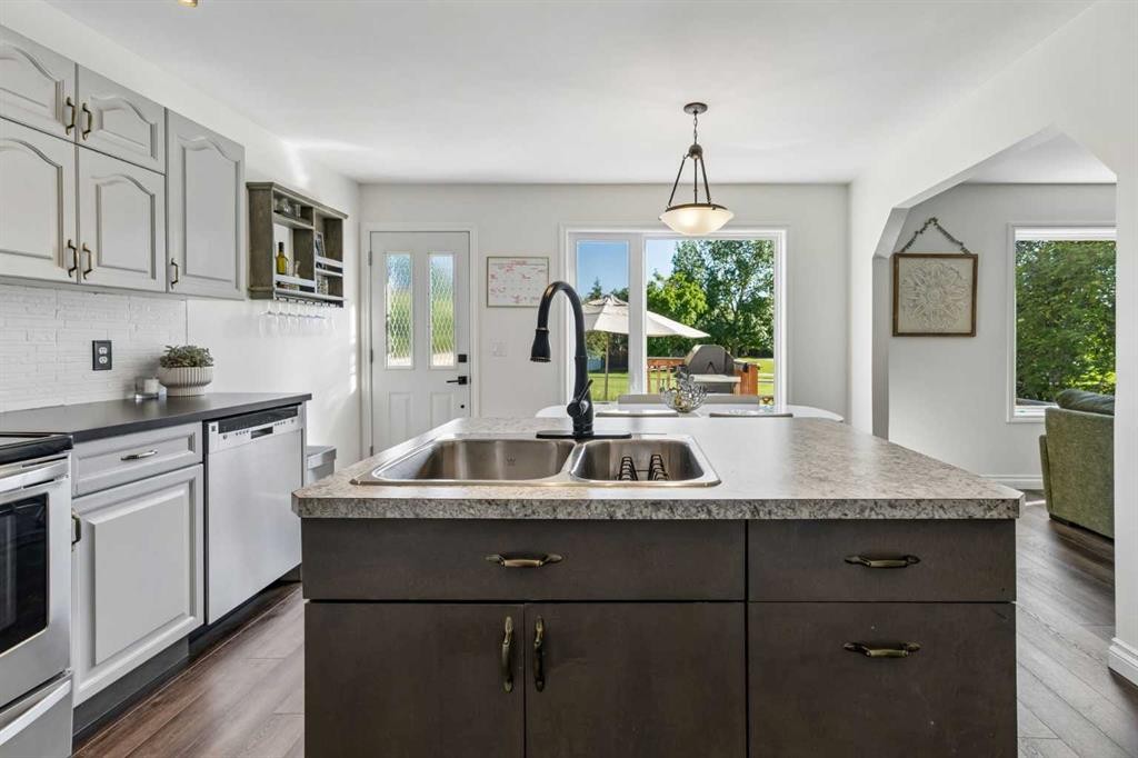 52 West Edge Road, Cochrane, AB - Indoor Photo Showing Kitchen With Double Sink