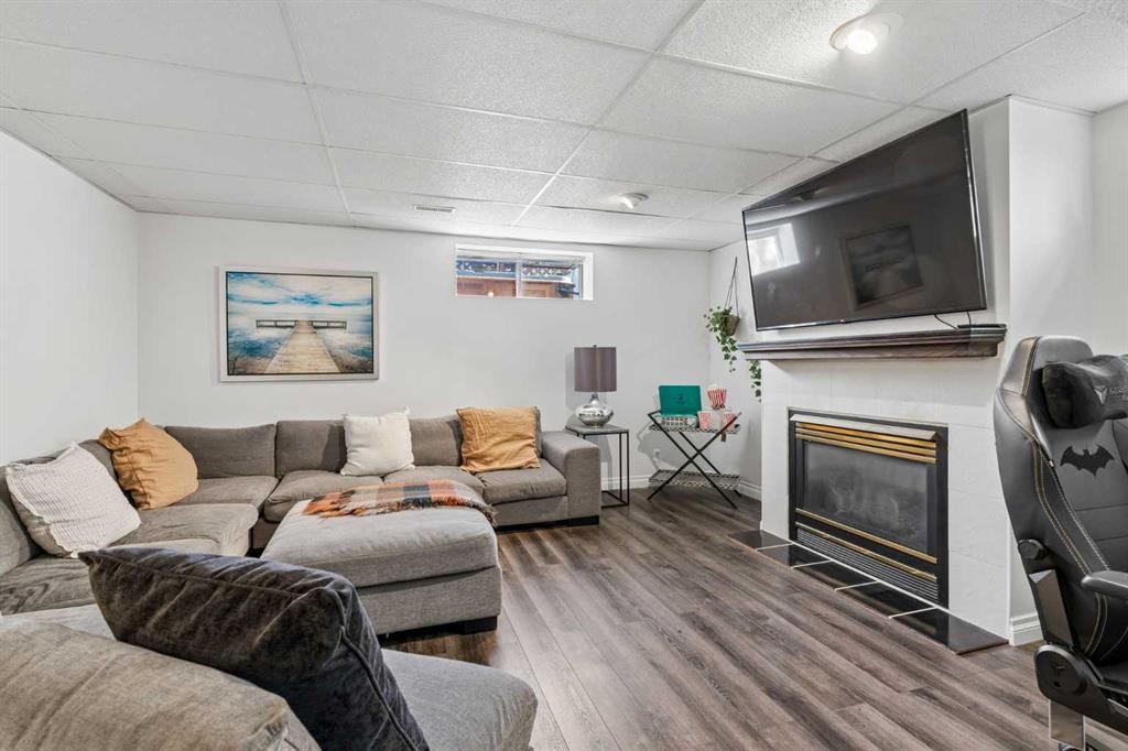 52 West Edge Road, Cochrane, AB - Indoor Photo Showing Living Room With Fireplace