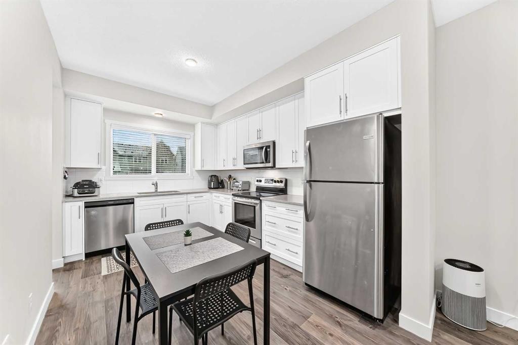 112 Carrington Boulevard Nw, Calgary, AB - Indoor Photo Showing Kitchen With Stainless Steel Kitchen