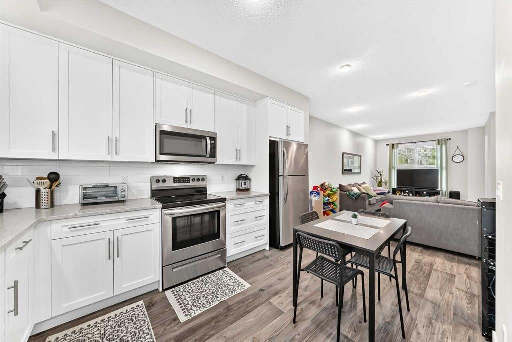 112 Carrington Boulevard Nw, Calgary, AB - Indoor Photo Showing Kitchen With Stainless Steel Kitchen