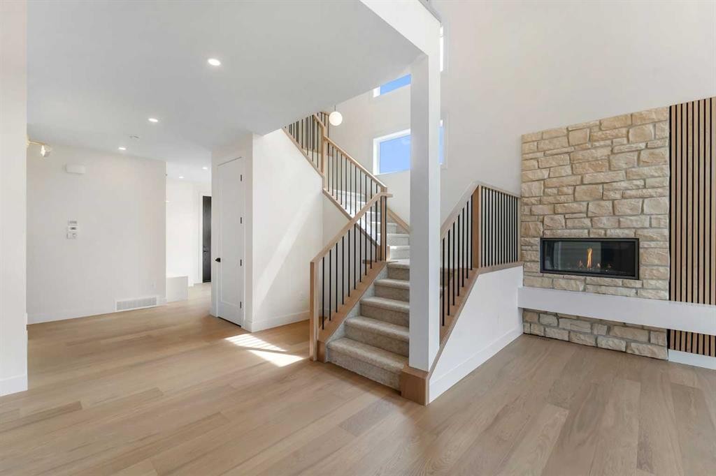 99 South Shore Road, Chestermere, AB - Indoor Photo Showing Other Room With Fireplace