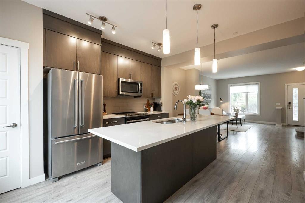 156 Livingston Common Ne, Calgary, AB - Indoor Photo Showing Kitchen With Double Sink With Upgraded Kitchen