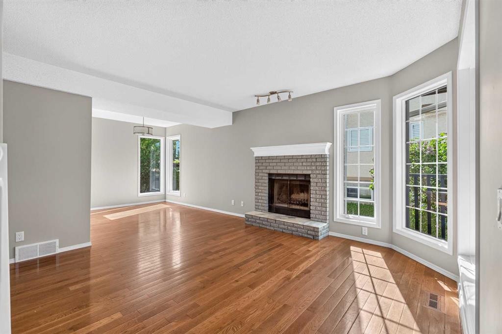 70 West Mackay Crescent, Cochrane, AB - Indoor Photo Showing Living Room With Fireplace