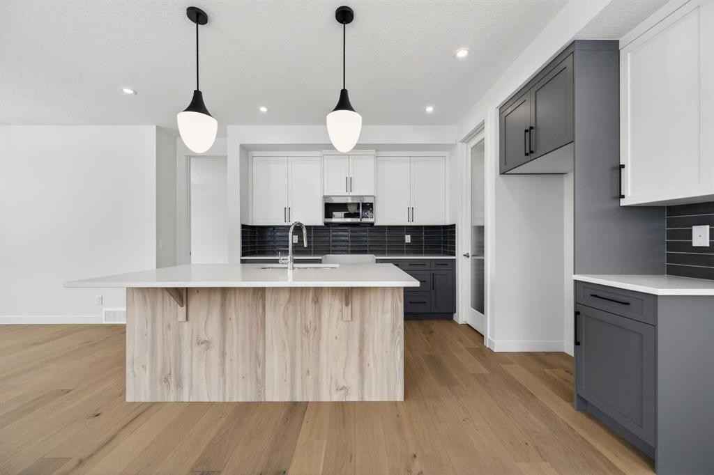 277 Waterford Way, Chestermere, AB - Indoor Photo Showing Kitchen With Upgraded Kitchen