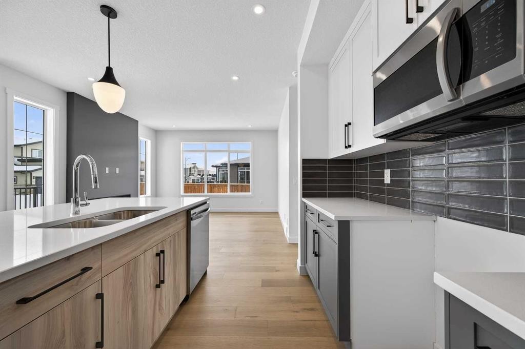 277 Waterford Way, Chestermere, AB - Indoor Photo Showing Kitchen With Double Sink