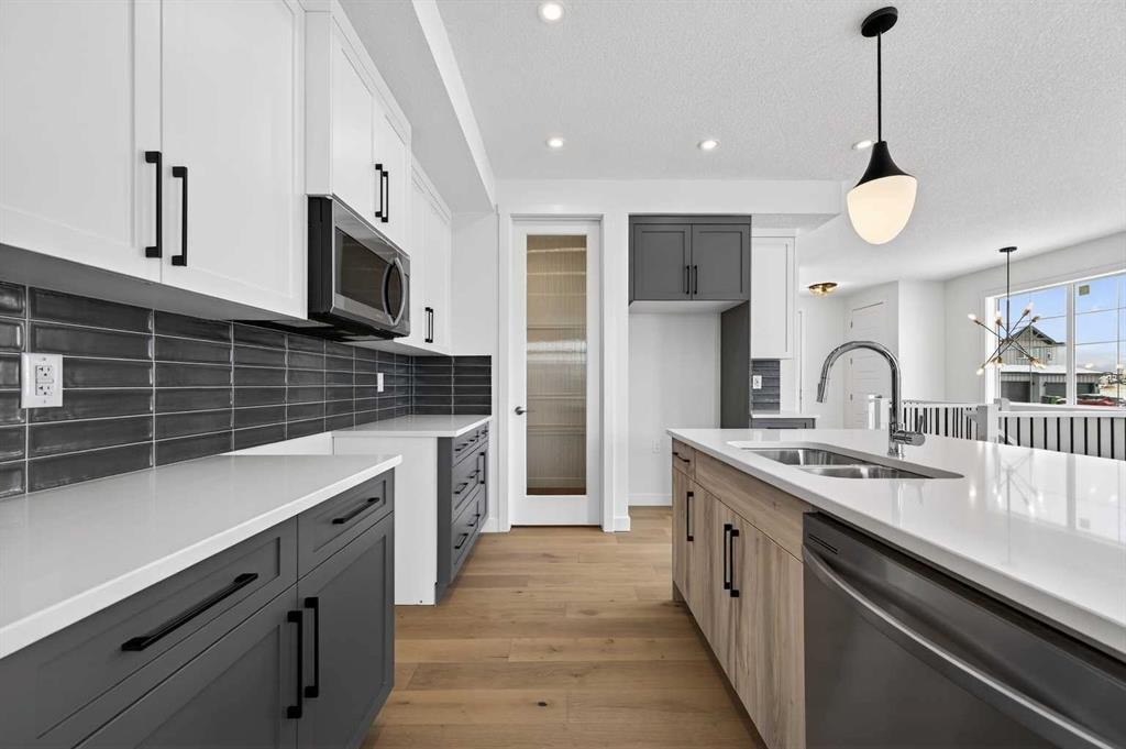277 Waterford Way, Chestermere, AB - Indoor Photo Showing Kitchen With Double Sink With Upgraded Kitchen