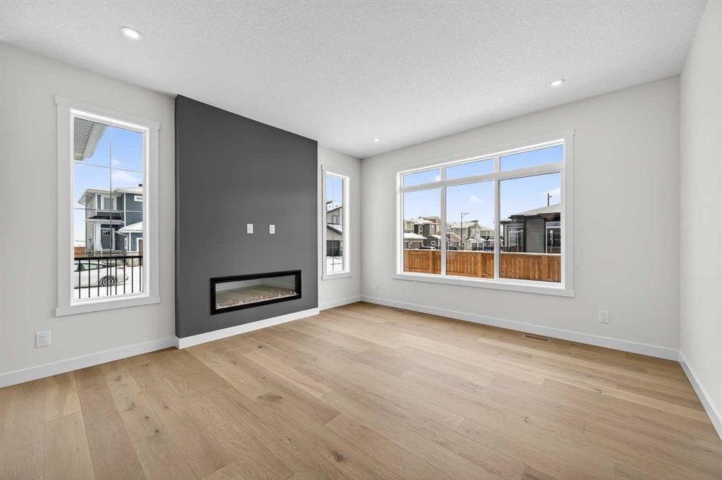 277 Waterford Way, Chestermere, AB - Indoor Photo Showing Living Room With Fireplace