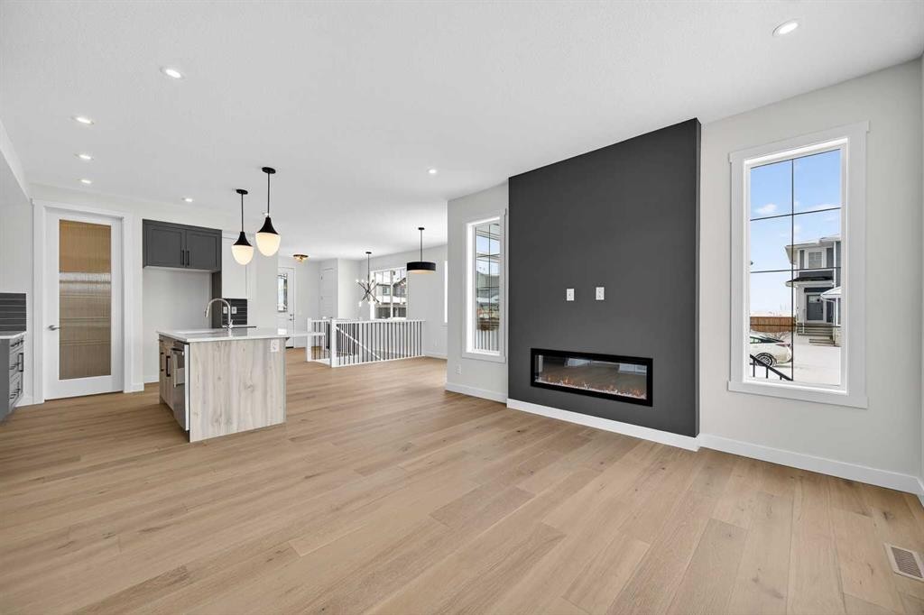277 Waterford Way, Chestermere, AB - Indoor Photo Showing Living Room With Fireplace