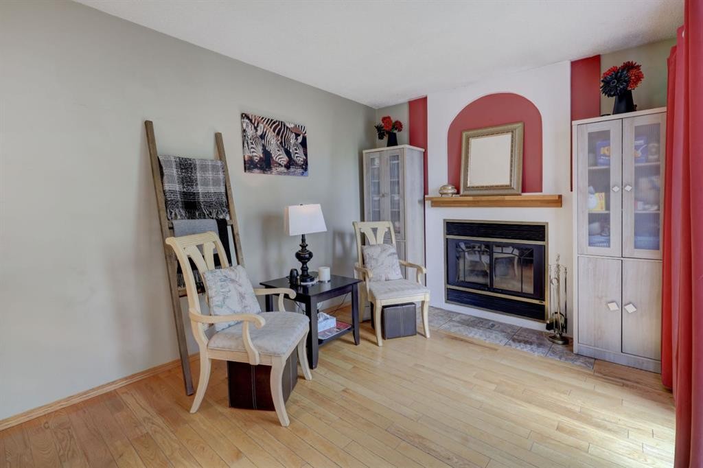 128 Pineland Place Ne, Calgary, AB - Indoor With Fireplace