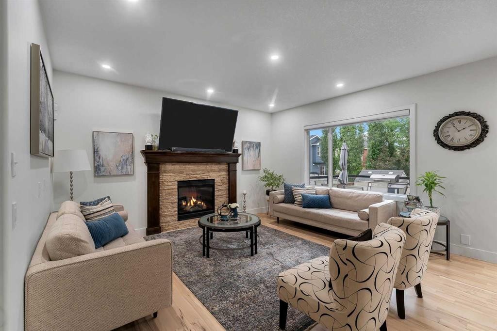 109 Evanscove Heights Nw, Calgary, AB - Indoor Photo Showing Living Room With Fireplace