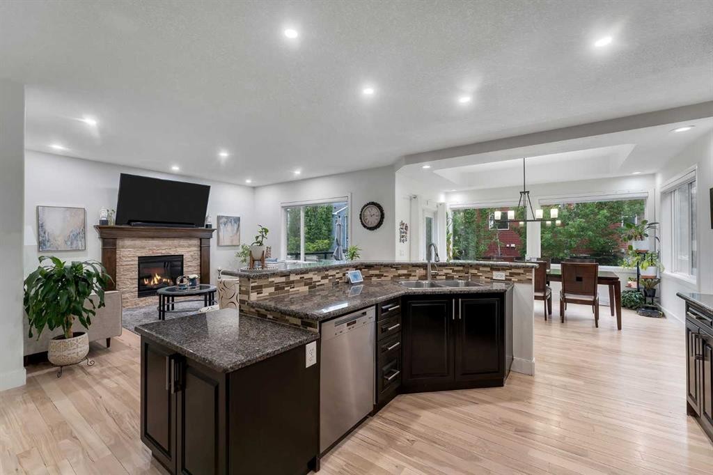 109 Evanscove Heights Nw, Calgary, AB - Indoor Photo Showing Kitchen With Fireplace