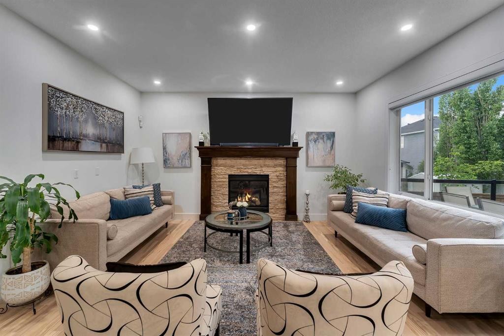 109 Evanscove Heights Nw, Calgary, AB - Indoor Photo Showing Living Room With Fireplace