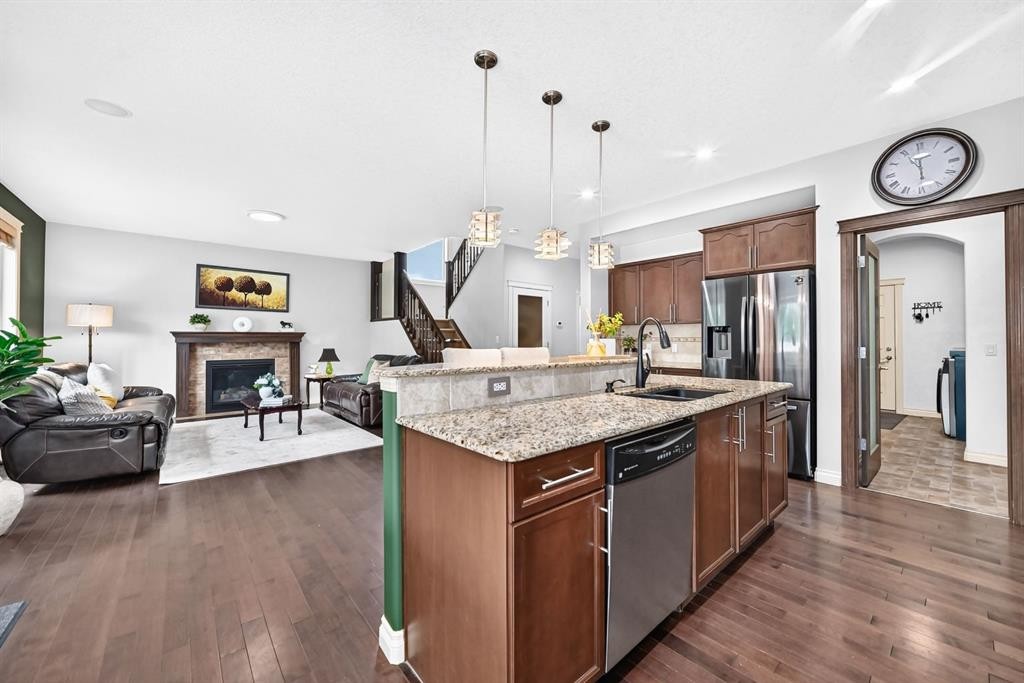 188 Magenta Crescent, Chestermere, AB - Indoor Photo Showing Kitchen With Fireplace With Upgraded Kitchen