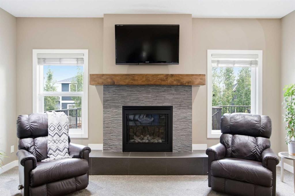 300 Aspenmere Way, Chestermere, AB - Indoor Photo Showing Living Room With Fireplace