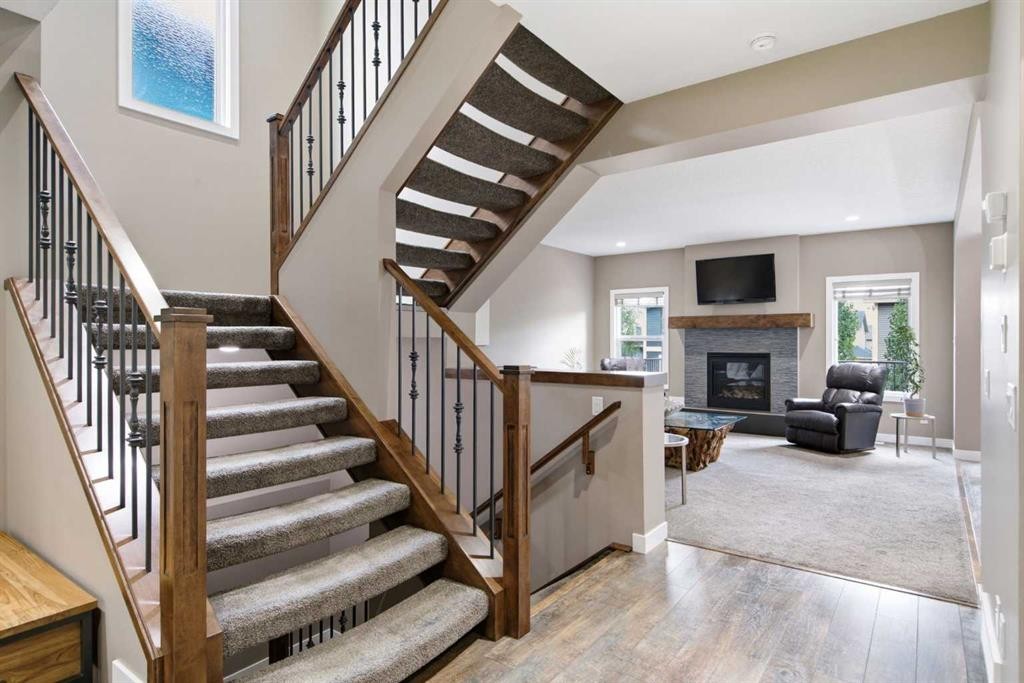 300 Aspenmere Way, Chestermere, AB - Indoor Photo Showing Other Room With Fireplace